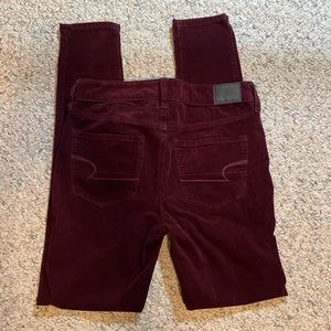 Wine-colored, corduroy skinny jeans.
